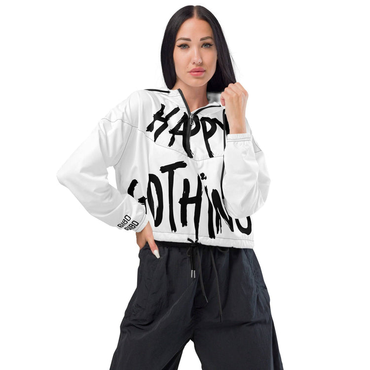 Model styled in white cropped windbreaker with bold &