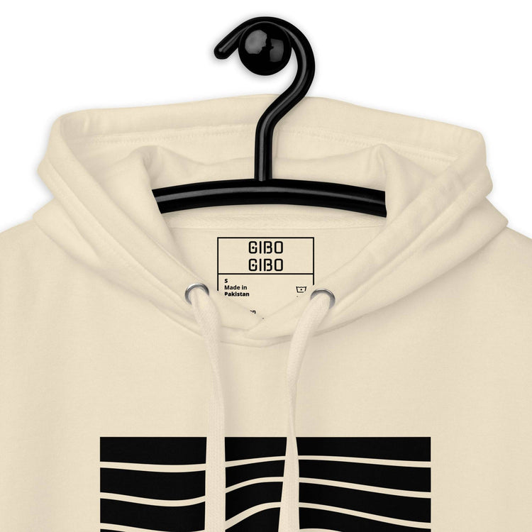 Close-up of the beige hoodie’s hood and label, showcasing the premium fabric and attention to detail.