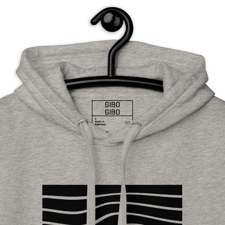Close-up of the gray hoodie’s hood and label, highlighting the premium fabric and detailed craftsmanship.