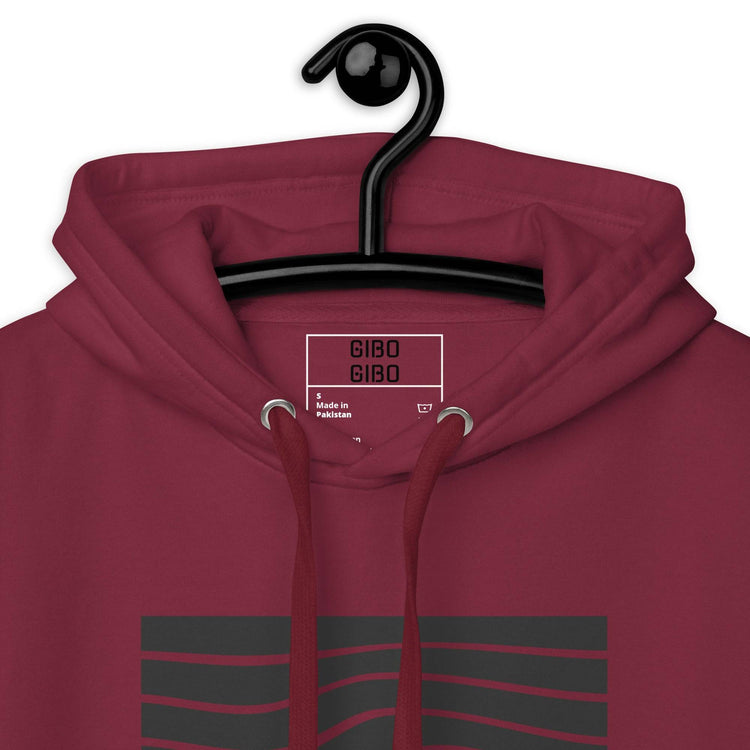 Close-up of the maroon hoodie’s hood and label, showcasing the high-quality fabric and design details.