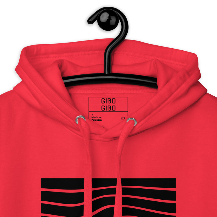 Close-up of the red hoodie’s hood and label, emphasizing the premium fabric and detailed craftsmanship.