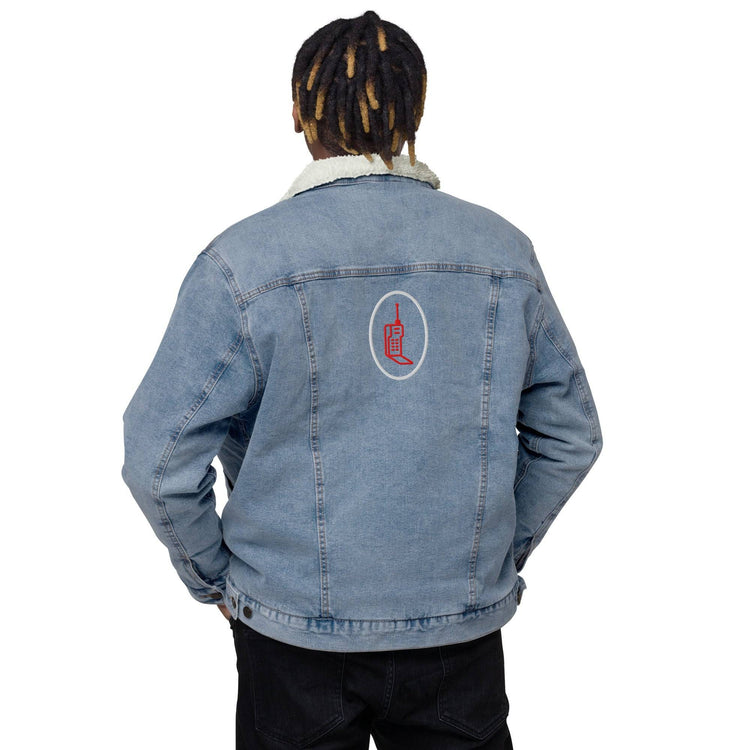 Back view of light blue denim sherpa jacket with embroidered red phone graphic. Modeled with a casual fit and sustainable design.