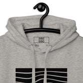Close-up of the gray hoodie’s hood and label, highlighting the premium fabric and detailed craftsmanship.
