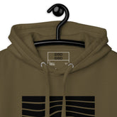 Close-up of the olive hoodie’s hood and label, highlighting the high-quality stitching and design details.