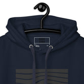 Close-up of the navy blue hoodie’s hood and inner label, highlighting the quality stitching and design details.