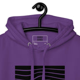 Close-up of the purple hoodie’s hood and inner label, emphasizing the quality craftsmanship and design.