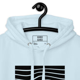 Close-up of the light blue hoodie’s hood and label, emphasizing the quality stitching and stylish design.
