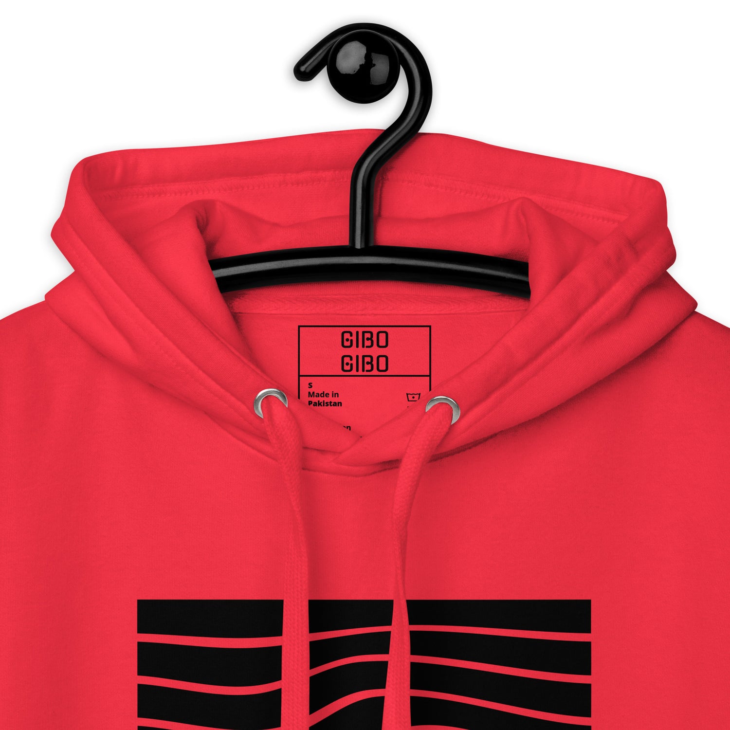 Close-up of the red hoodie’s hood and label, emphasizing the premium fabric and detailed craftsmanship.