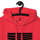 Close-up of the red hoodie’s hood and label, emphasizing the premium fabric and detailed craftsmanship.