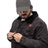 Black denim sherpa jacket with eco-friendly wool lining, featuring a red embroidered logo on the chest. Modeled with button closure.